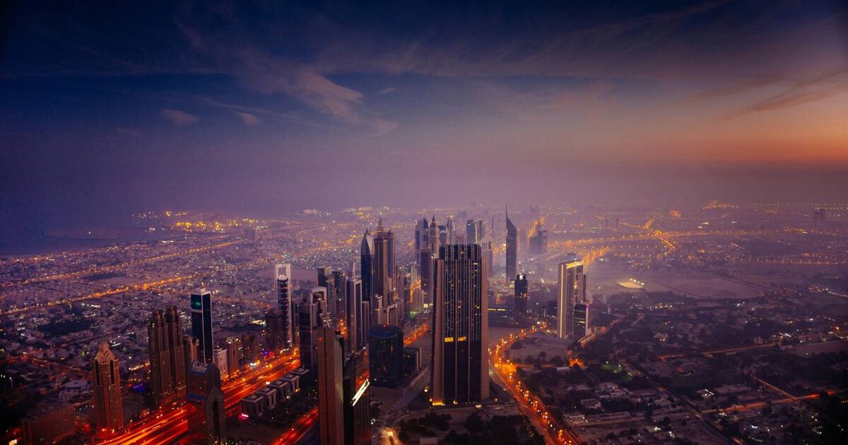 Refrigerated van on a Dubai road at dusk